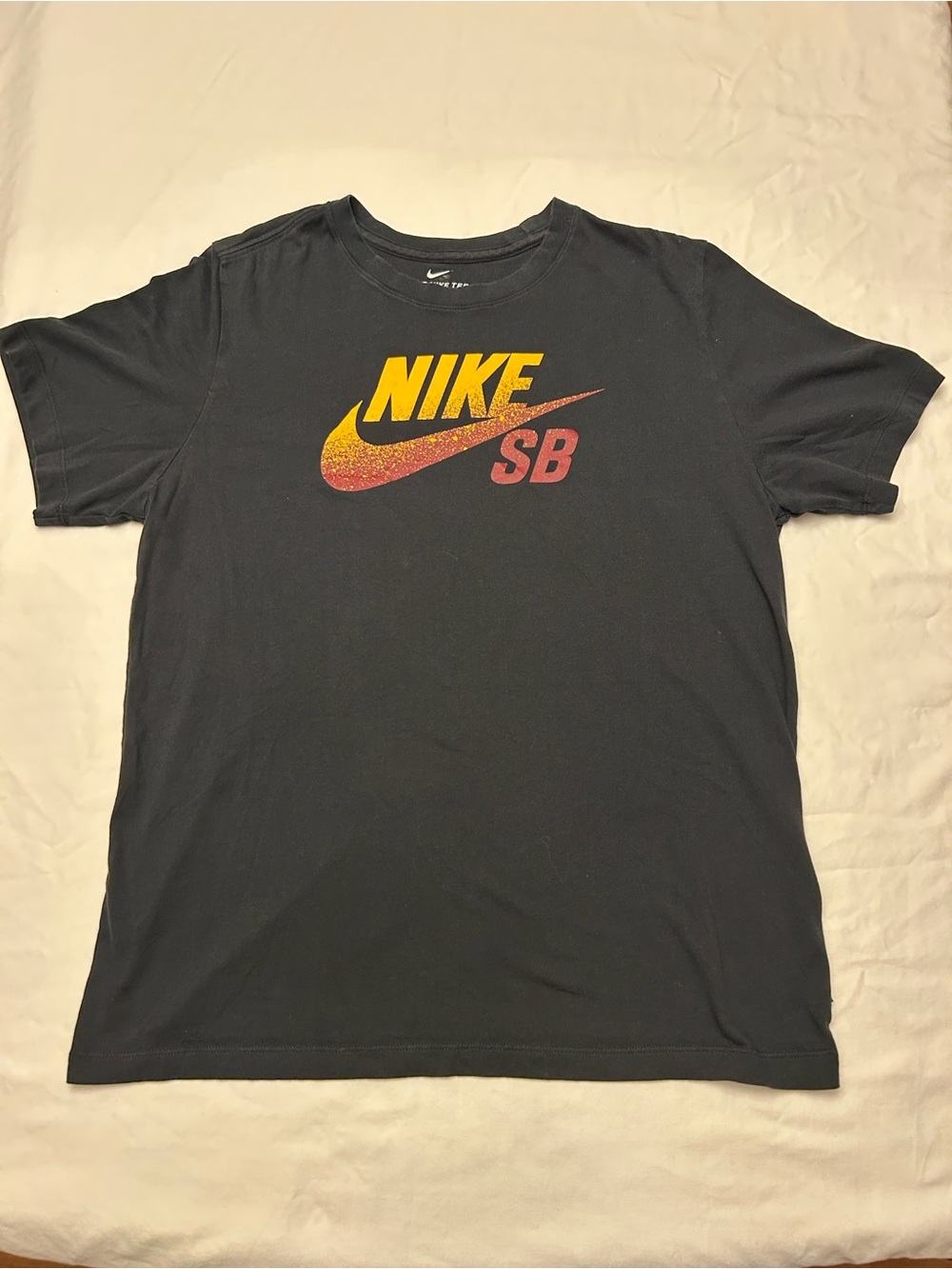 Nike Black Short Sleeve SB Logo Tee with Yellow and Red Accents